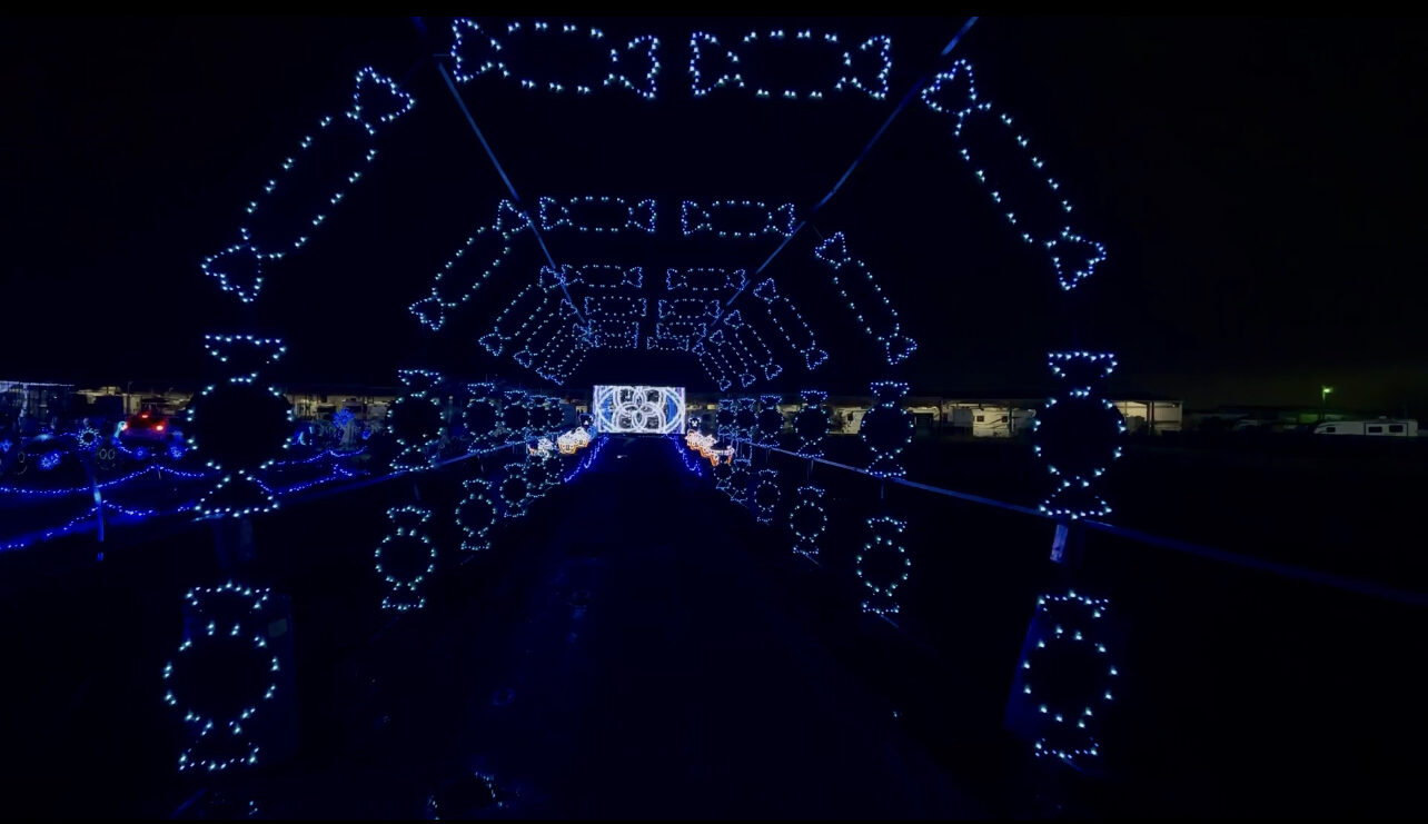 Glowing blue and magenta light display at night